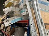 a pile of boxes and boxes on a shelf in a warehouse