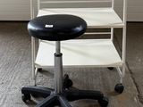 an image of a chair and a stool in a garage