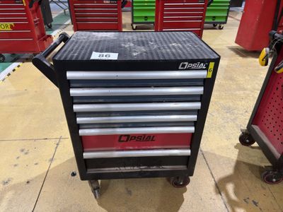 a close up of a tool box on a cart in a garage