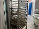 an image of a commercial kitchen with a large pan rack