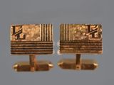 deux paires de boutons de manchette en or portant les lettres « f » et « f »