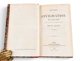 an open book with a baseball glove on top of it