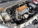 a car engine with its hood open and the hood down