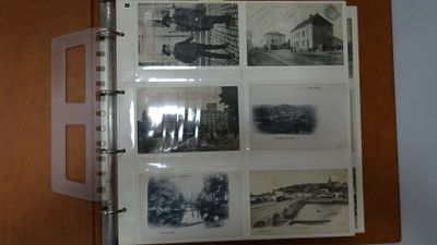 a binder with a bunch of old photos on it
