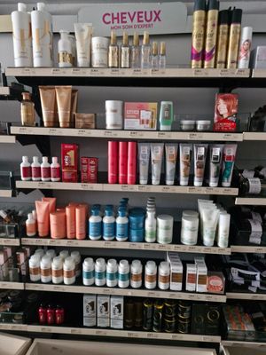 many different types of hair products on the shelves