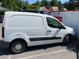 a white van that is parked in a parking lot