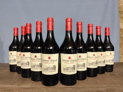 six bottles of red wine are lined up on a wooden table