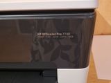 a printer that is sitting on a table next to a printer
