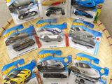 a lot of hot wheels cars on the table