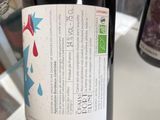 a bottle of wine that is being held by a person