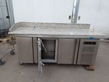 an image of a stainless steel kitchen with a granite counter top