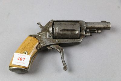 a close up of a gun on a table with a tag on it