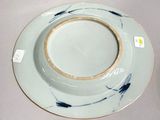 a white plate with a blue and white design on it