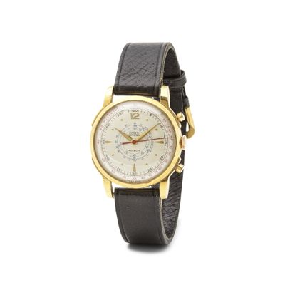 une image représentant une montre dorée et noire sur fond blanc