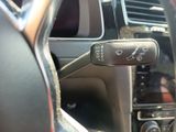 a close up of a car ' s dashboard with a remote control