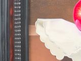 a picture of a painting of an apple on a cloth
