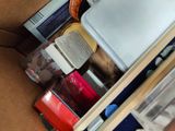 a brown box with a bunch of items inside of it