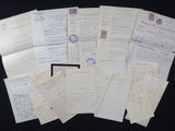 a pile of old letters on a black table