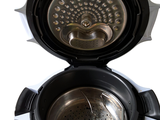 a close up of an electric pressure cooker with the lid open