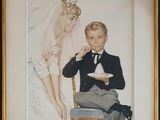 painting of a man and a woman eating cake in front of a mirror