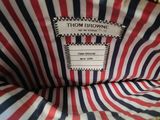the inside of a red, white, and blue striped purse