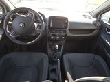 the interior of a small car with a steering wheel and dashboard