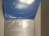 a picture of a blue box that is taped to the wall
