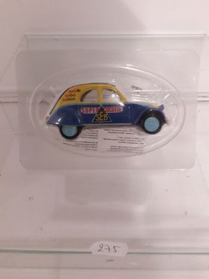 a small toy car in a clear plastic container