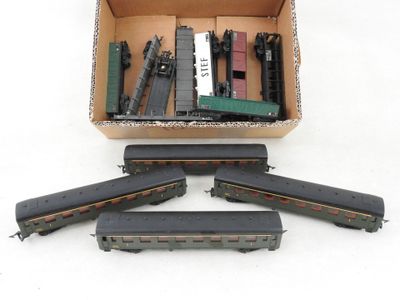 a box of toy trains sitting on a white surface