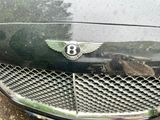 the front grille of a car with a number eight on it