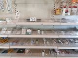 many shelves in the store that have various items on them