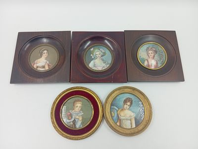 three framed pictures of a woman and a child on a white surface