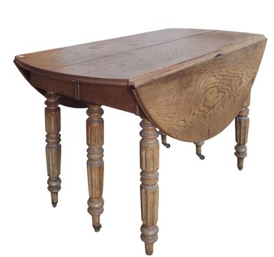 the table is made of wood and has turned legs