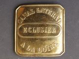 a close up of a gold bar on a black surface