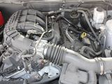 a picture of a car engine with its hood open