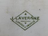 a white plate with a black and green logo on it