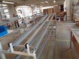 an image of a factory with a conveyor belt in the middle of the room