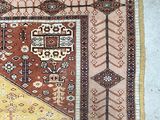 an image of a rug on the floor with a cat laying on it