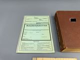 a brown box and a ruler next to a brown box