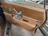a brown car door with a mirror on it