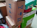 many boxes stacked on top of each other in a room