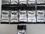 a lot of packets of condoms on a table