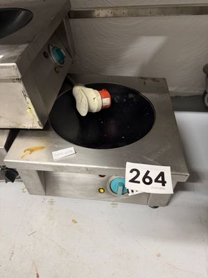 a stove top with a frying pan sitting on top of it