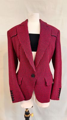 a close up of a red and black jacket on a mannequin dummy