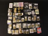 a lot of coins and other items on the table