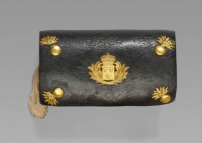 a black and gold purse with gold decorations on it