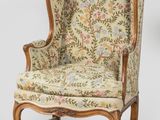 an antique chair with floral upholstered upholstered seat