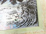 la photo d'une photo représentant une vague, dans un cadre