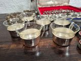 a table with a bunch of cups and containers on it