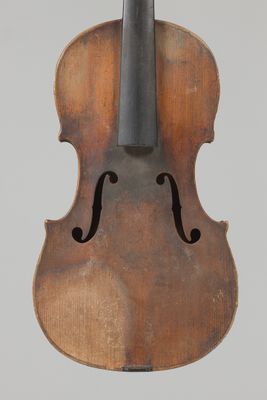 an old violin with a black bow on a white background